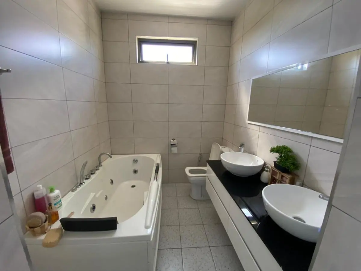 Luxury modern bathroom featuring a spa jacuzzi at Luxora Villa, Mauritius
