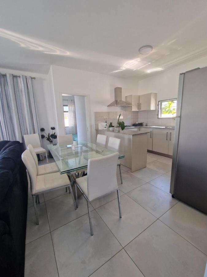 Modern fully-equipped kitchen and dining area