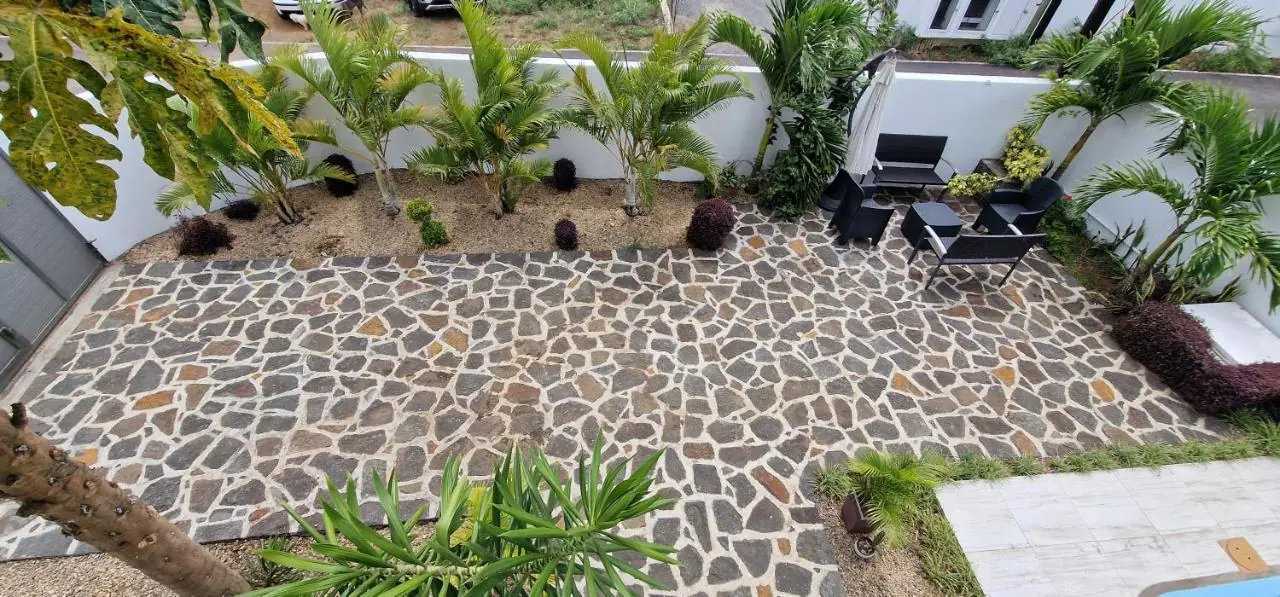 Manicured tropical garden and private pool area at Luxora Villa, luxury villa rental in Mauritius