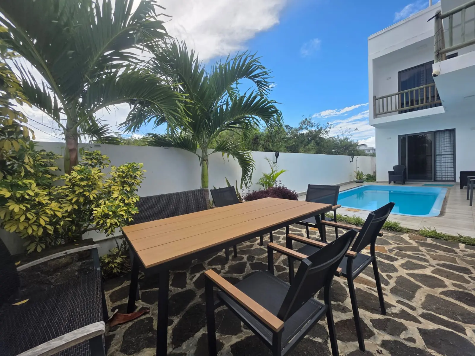 Exquisite outdoor dining terrace next to the private pool at Luxora Villa Mauritius