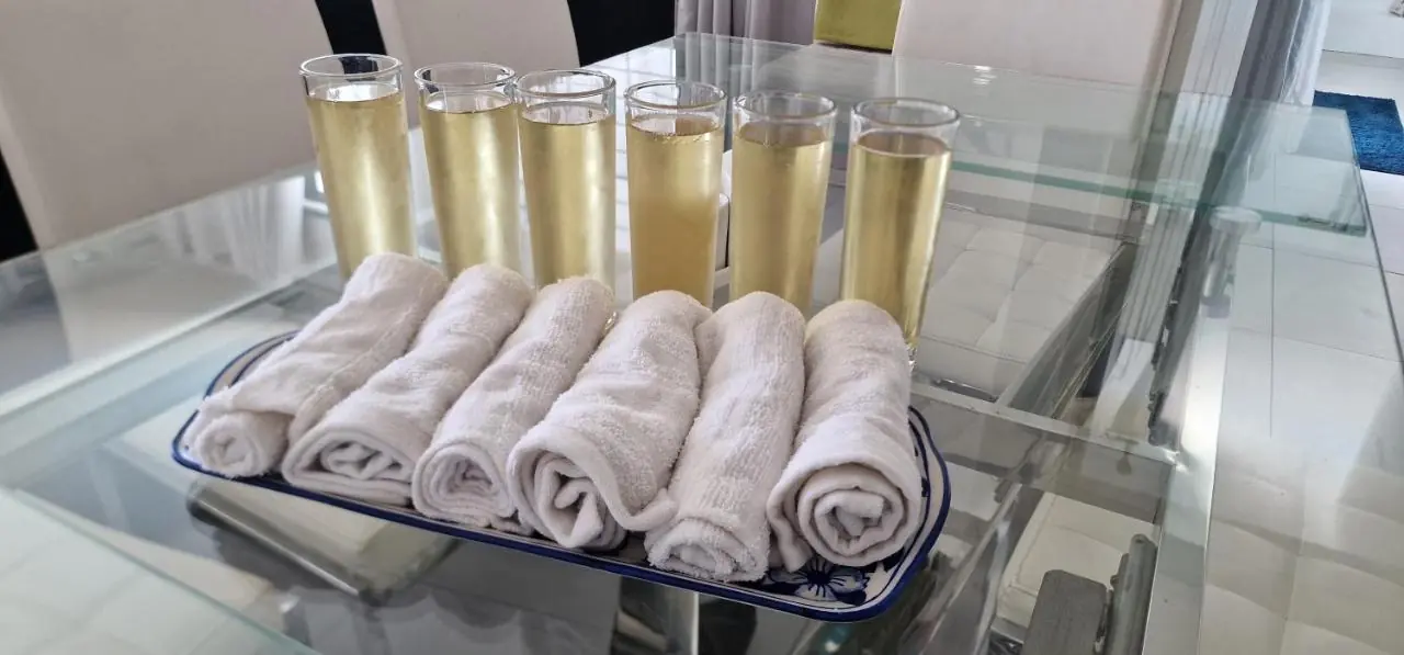 VIP welcome amenities with chilled champagne and fresh towels at Luxora Villa Mauritius